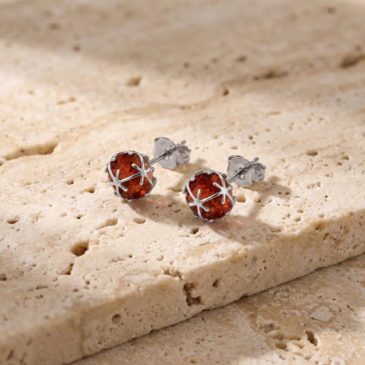 White Gold Garnet Stud Earrings — Alida — travertine lifestyle
