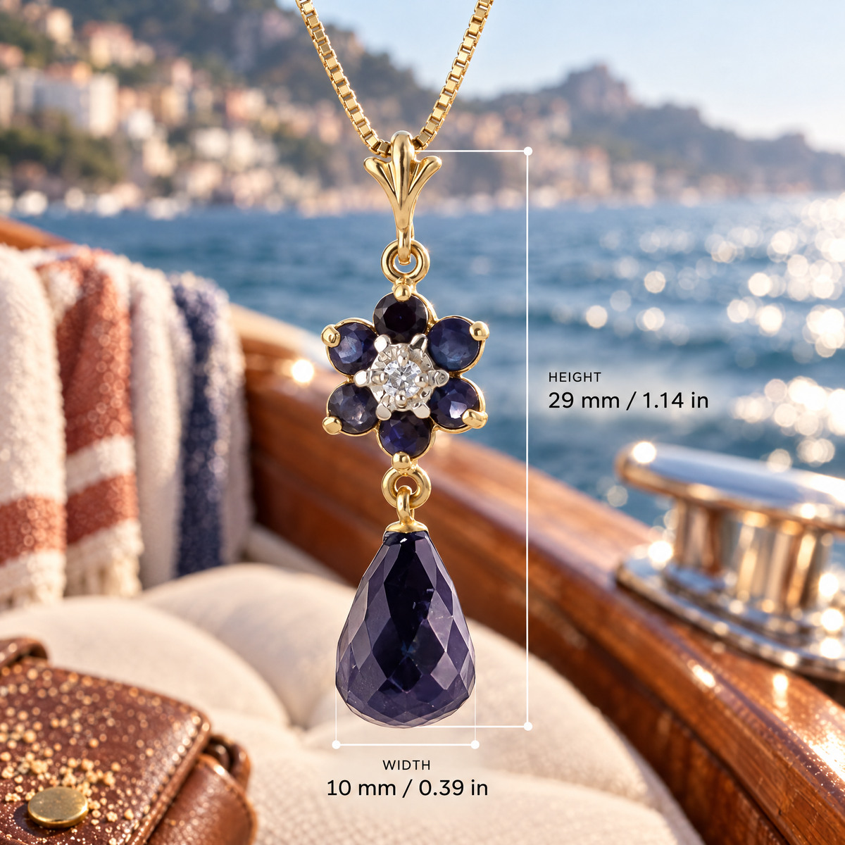 Yellow Gold Cassandra sapphire and diamond pendant with dimensions: 29 mm high and 10 mm wide, against a boat setting.