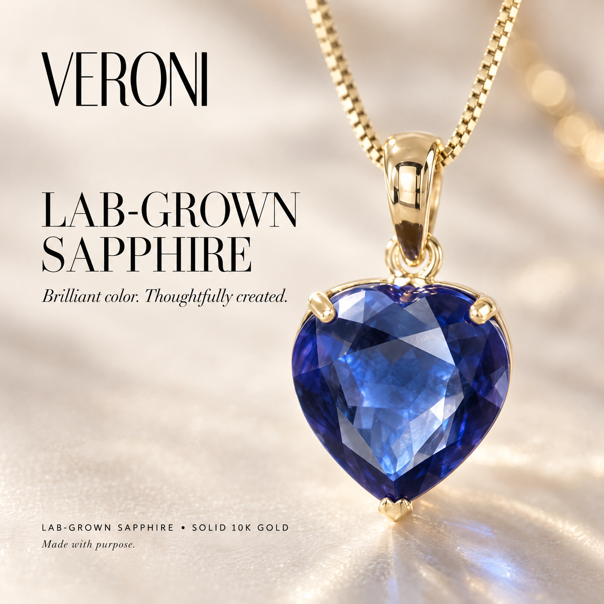 Yellow Gold Giuseppa lab-grown sapphire pendant on a warm ivory background in a VERONI campaign.