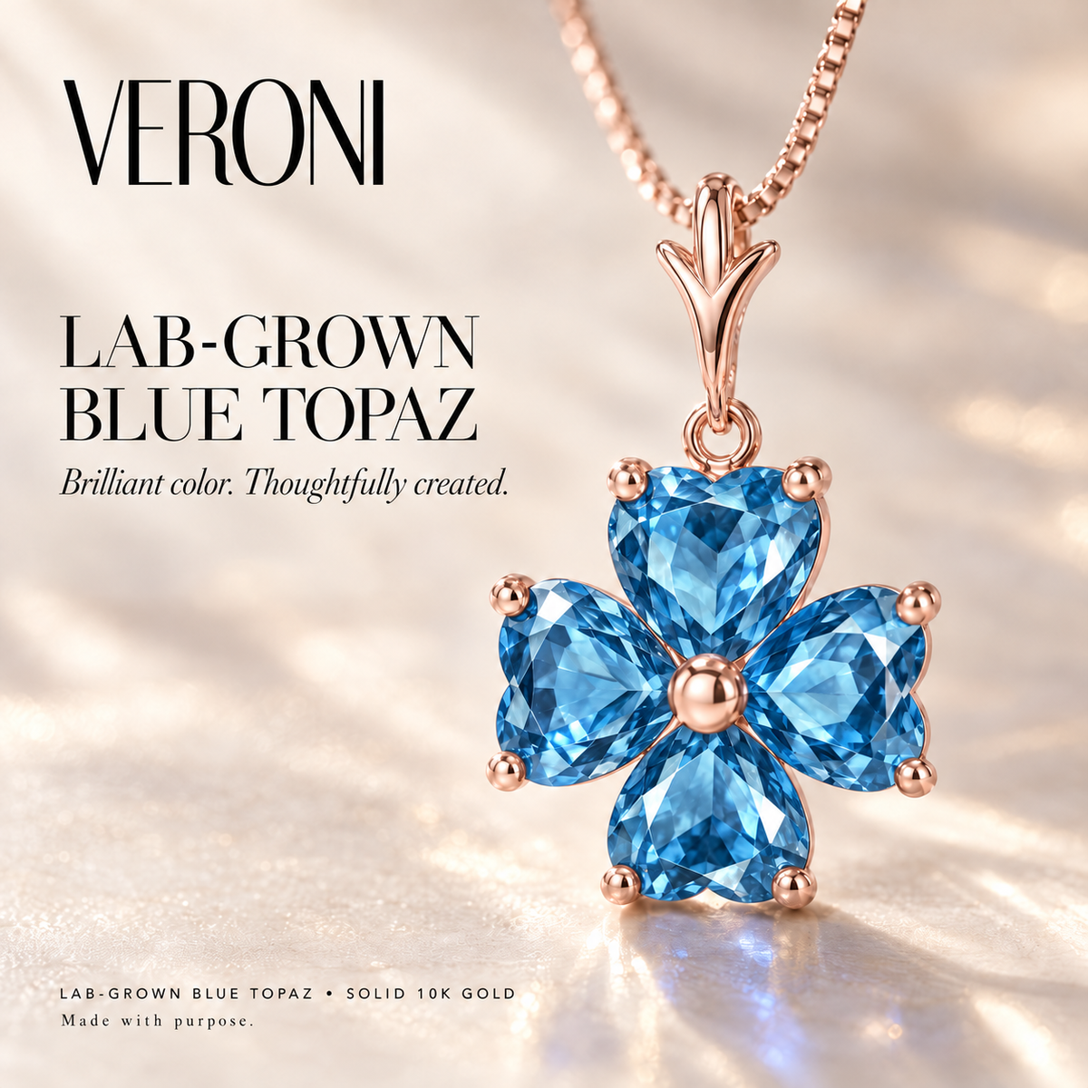 Rose Gold Selene lab-grown Blue Topaz necklace, in a VERONI campaign.