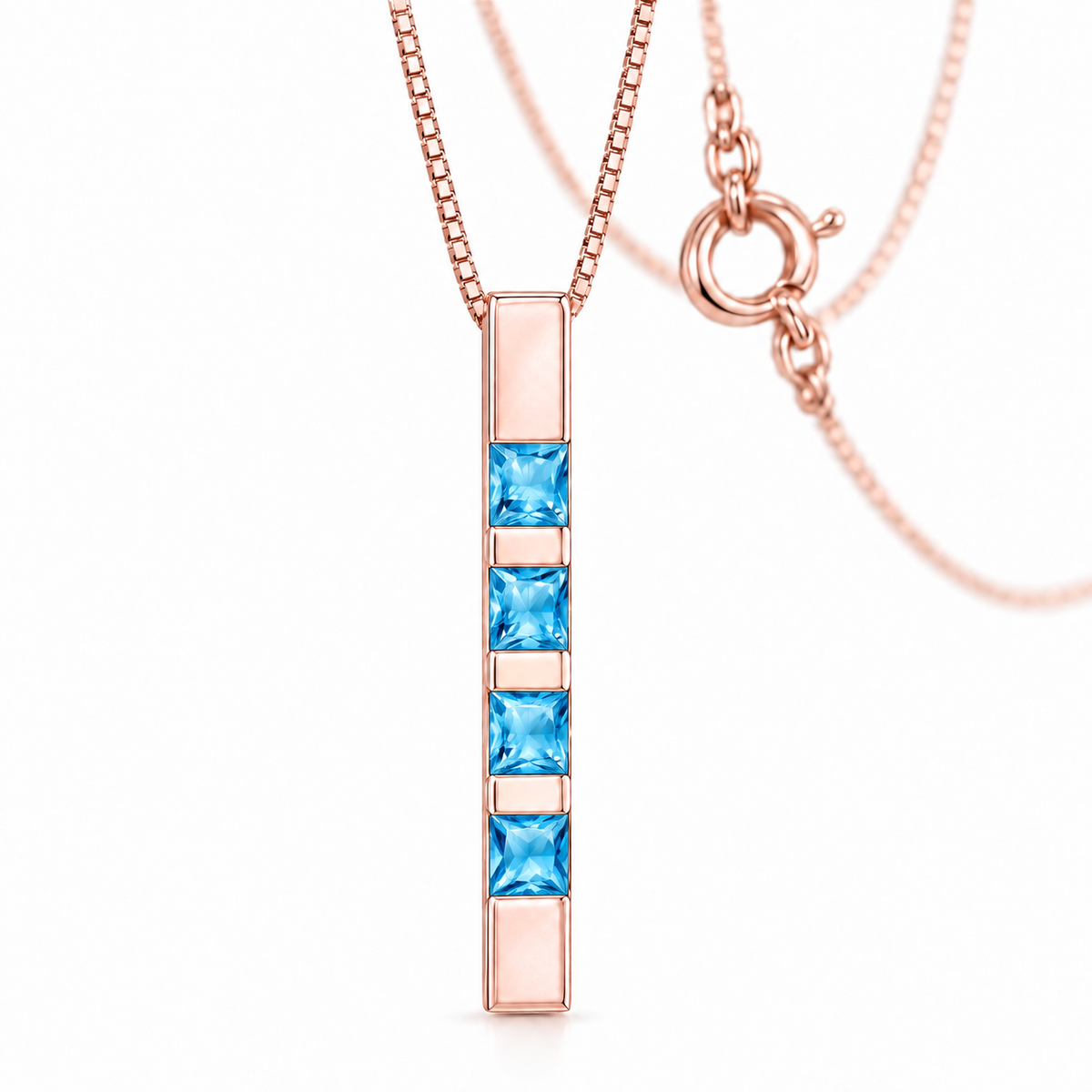 Rose Gold Gioconda lab-grown blue topaz necklace, shown with chain and clasp detail.