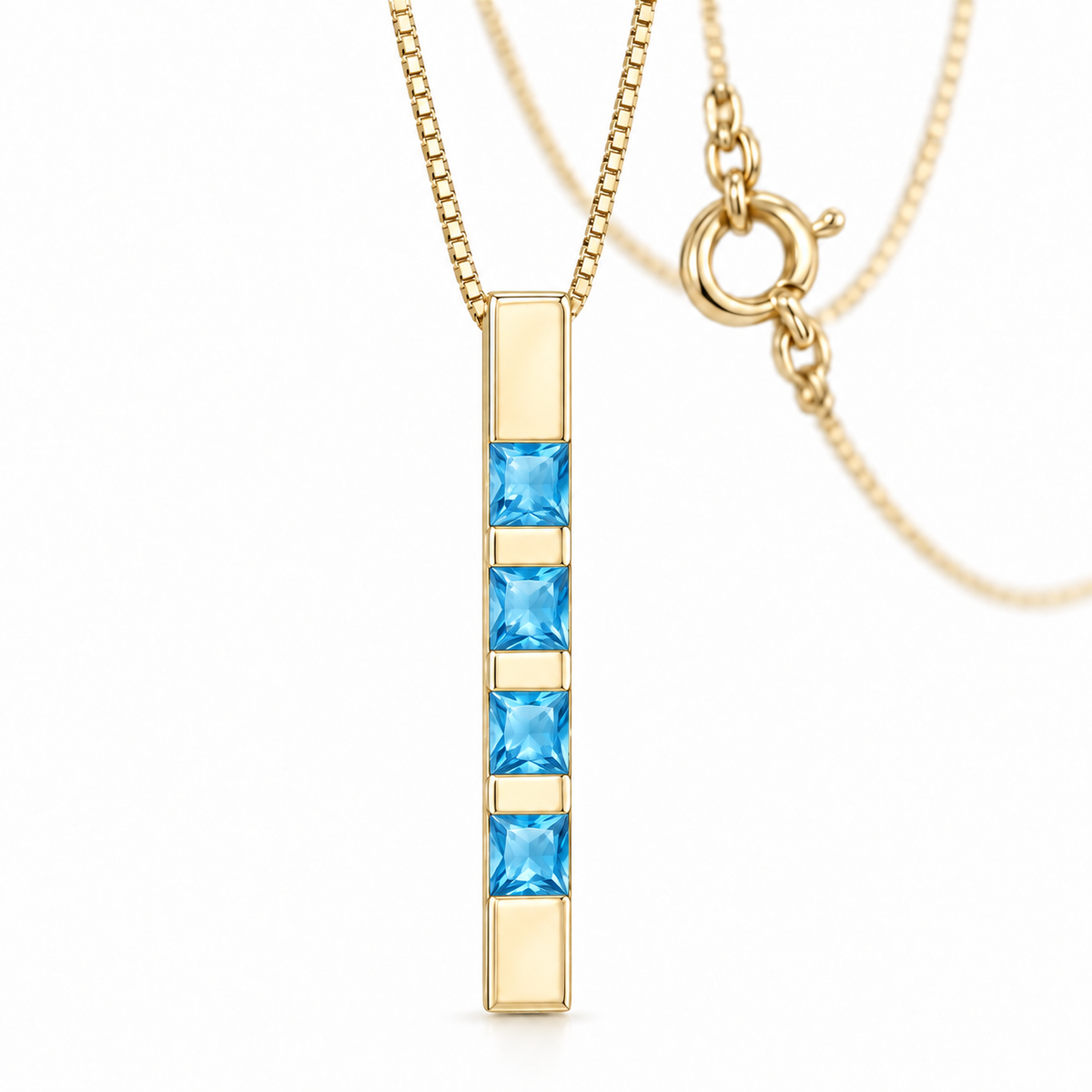 Yellow Gold Gioconda lab-grown blue topaz necklace, shown with chain and clasp detail.