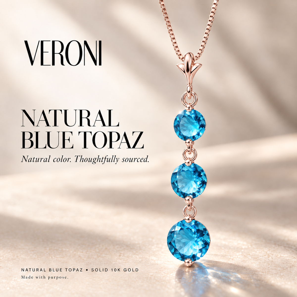 Rose Gold Provvidenza natural blue topaz necklace, in a VERONI campaign.