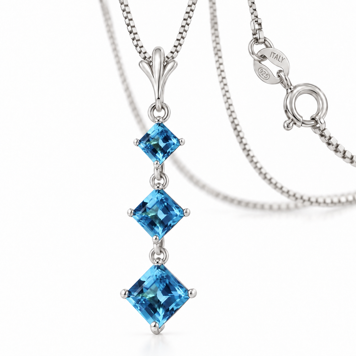 White Gold Pia natural blue topaz necklace, shown with chain and clasp detail.