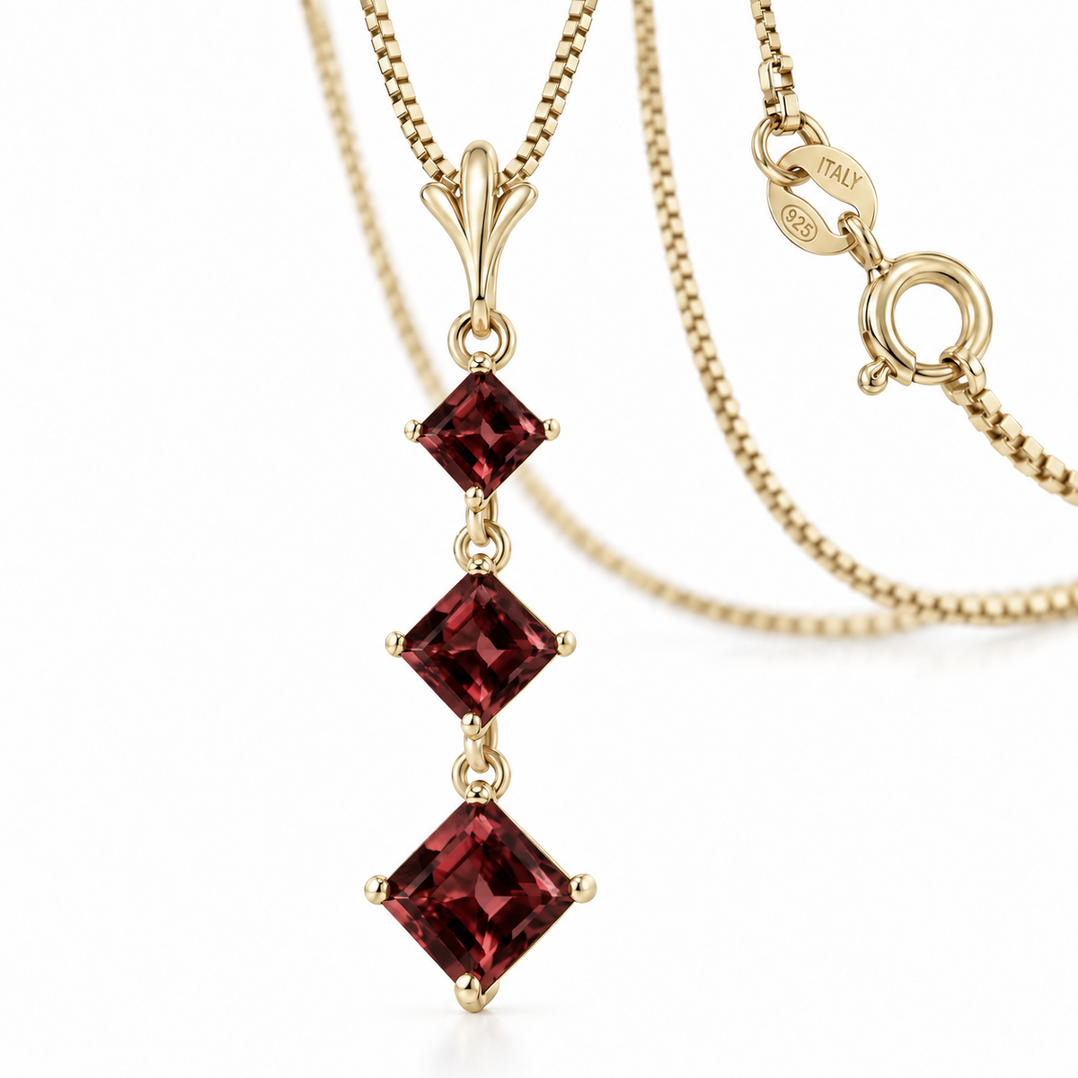 Yellow Gold Pia natural garnet necklace, shown with chain and clasp detail.