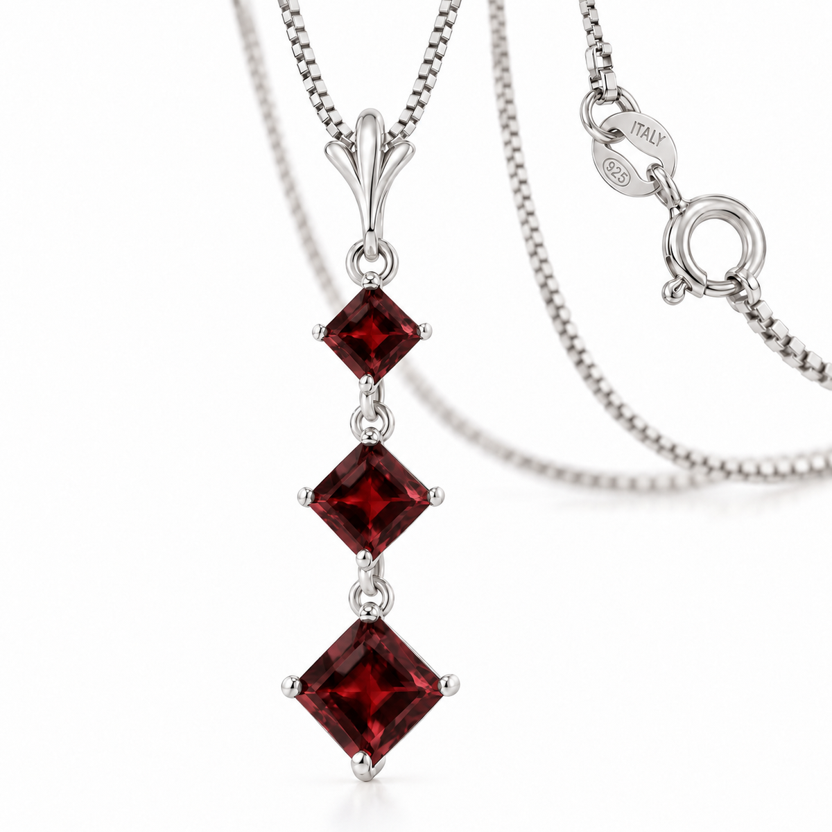 White Gold Pia natural garnet necklace, shown with chain and clasp detail.