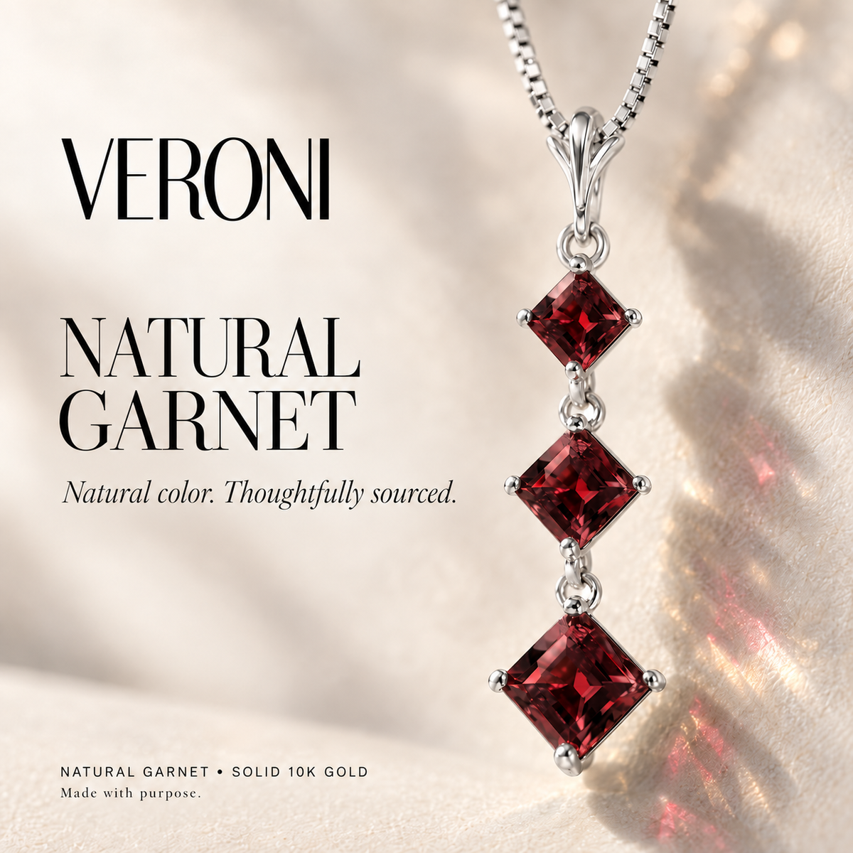 White Gold Pia natural garnet necklace, in a VERONI campaign.