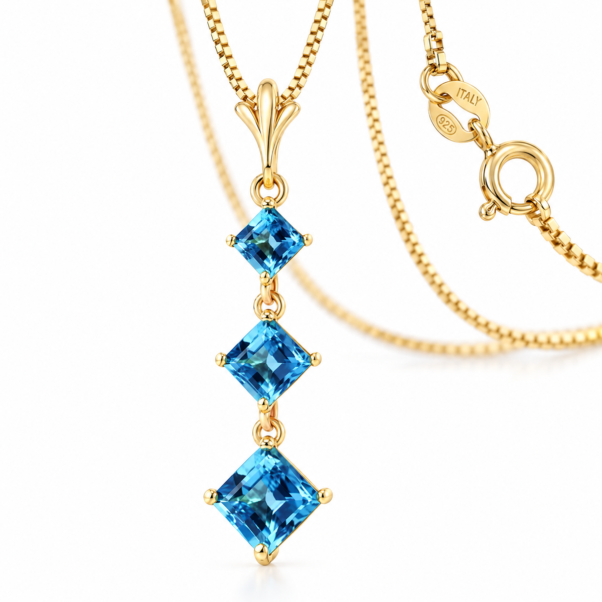 Yellow Gold Pia natural blue topaz necklace, shown with chain and clasp detail.