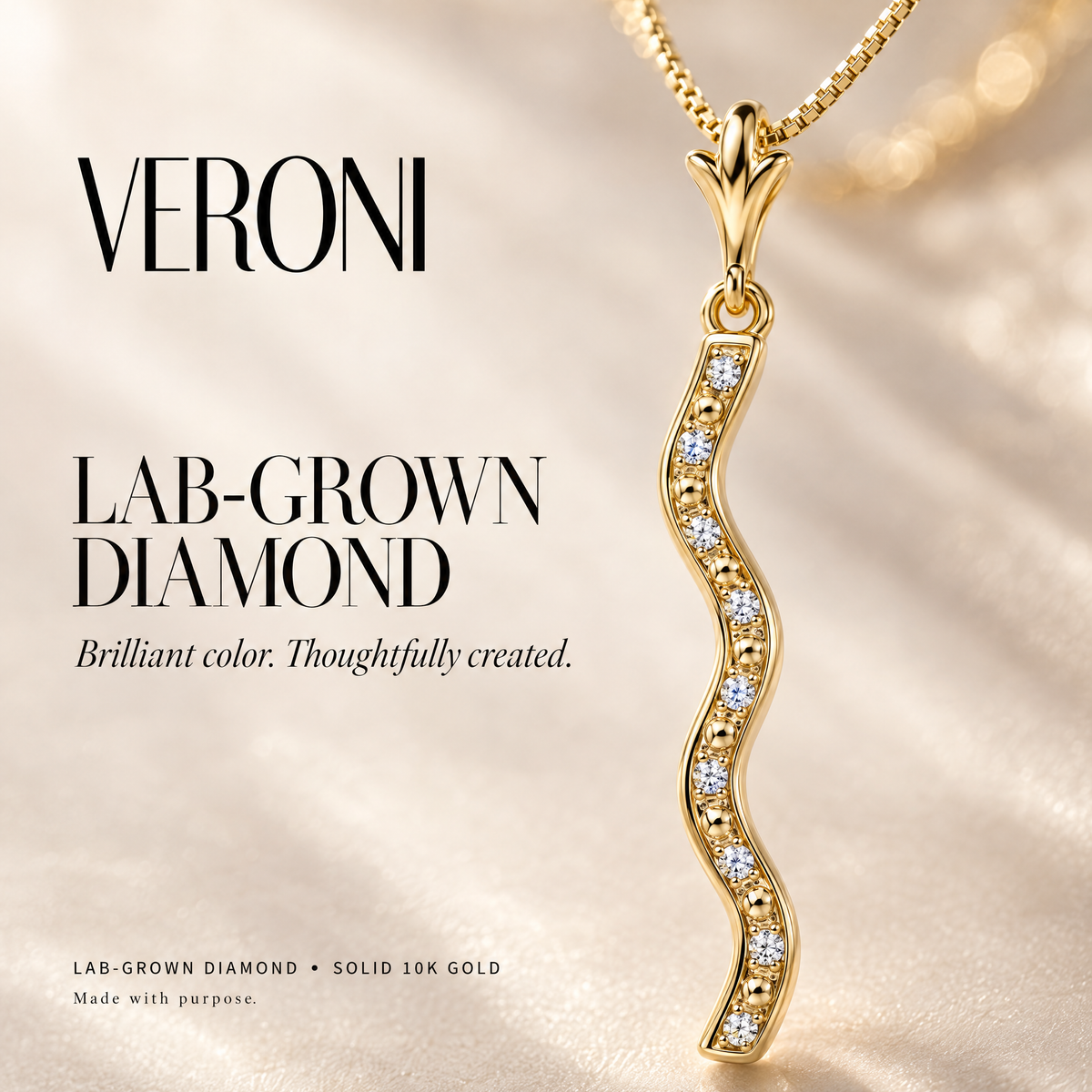 Yellow Gold Marcellina lab-grown diamond pendant on a warm ivory background in a VERONI campaign.