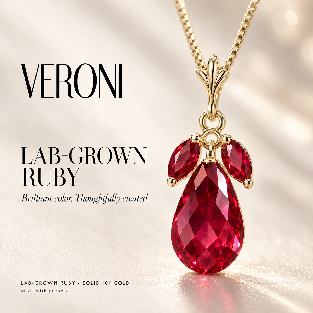 Yellow Gold Laura lab-grown ruby pendant on a warm ivory background in a VERONI campaign.