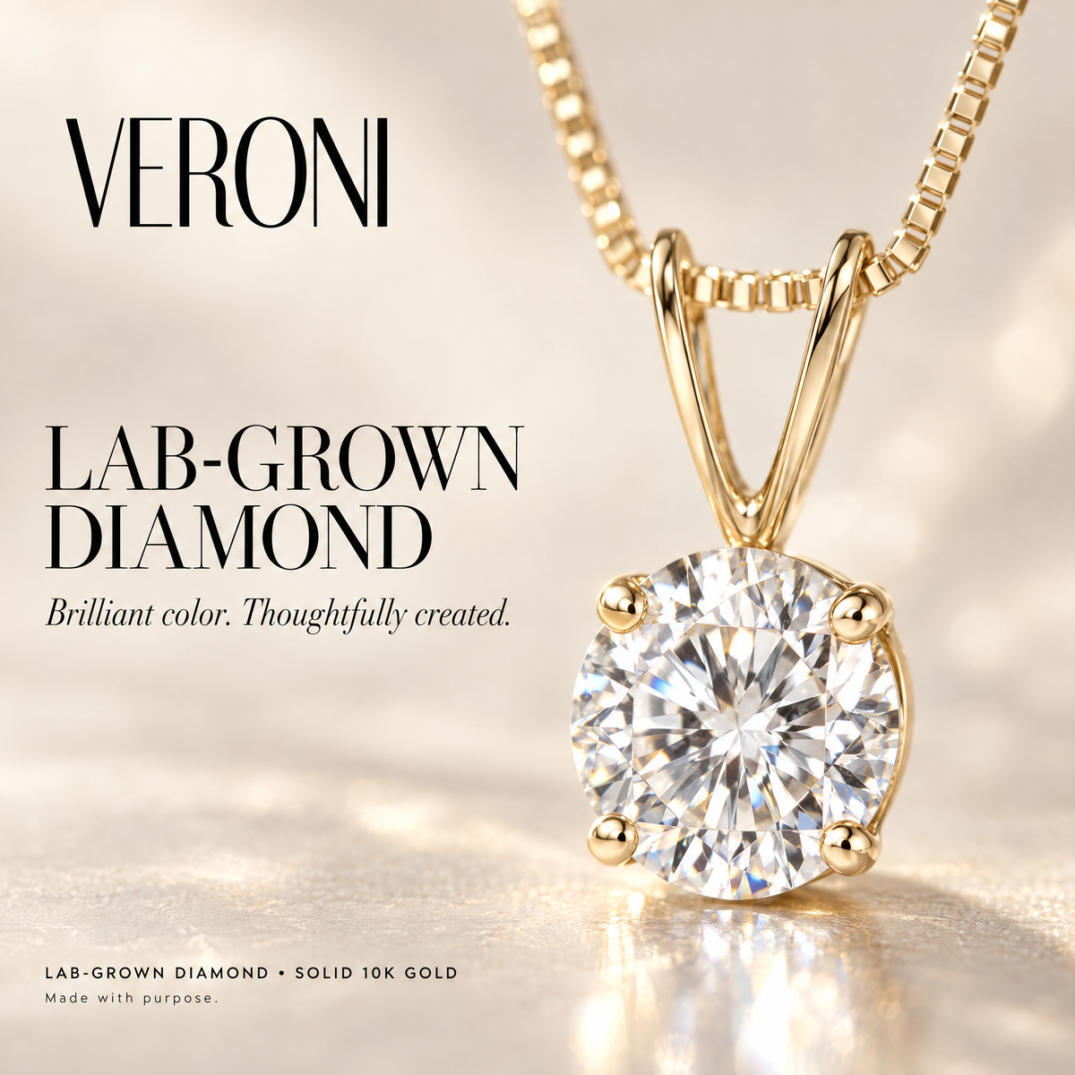 Yellow Gold Lia lab-grown diamond pendant on a warm ivory background in a VERONI campaign.