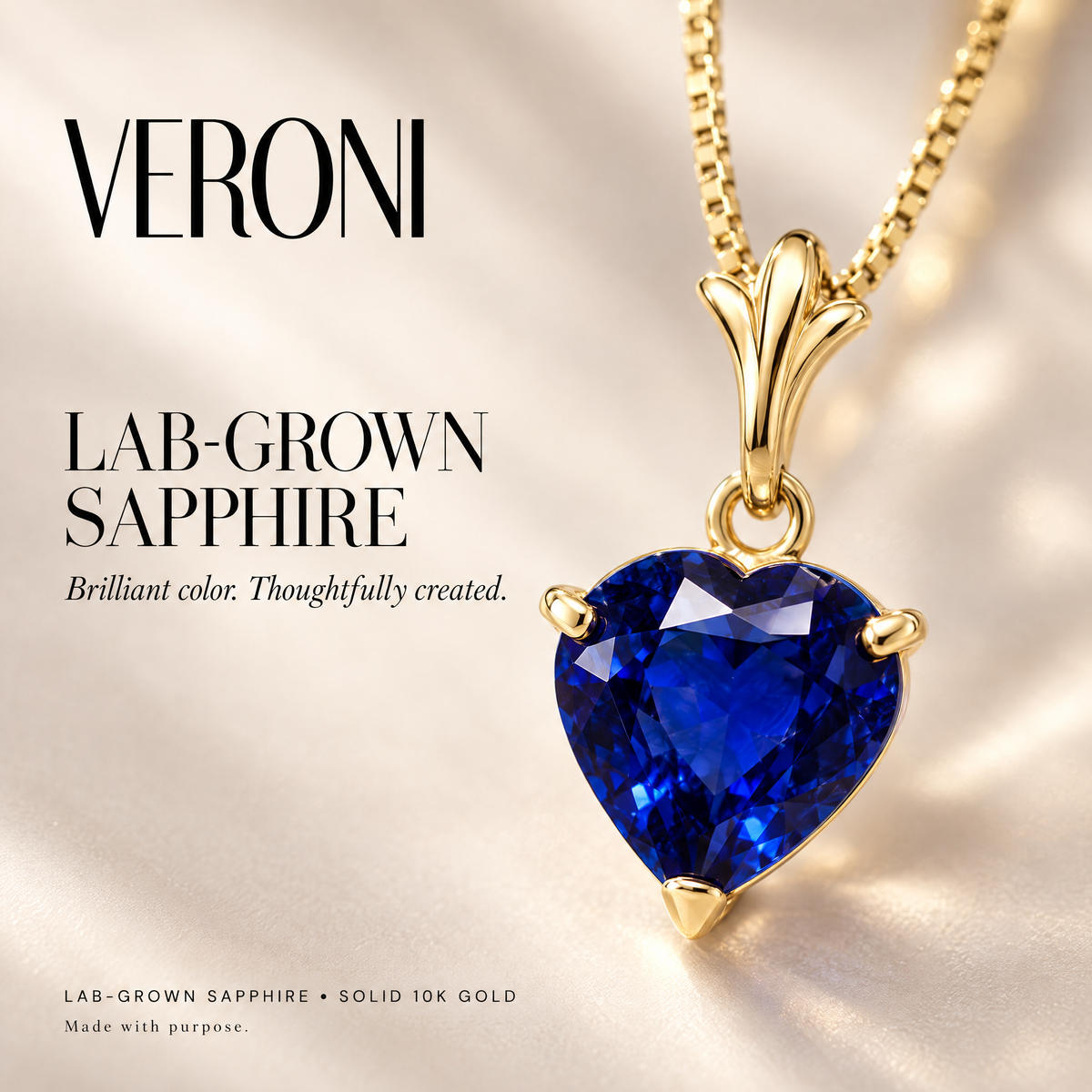 Yellow Gold Alida lab-grown sapphire pendant on a warm ivory background in a VERONI campaign.