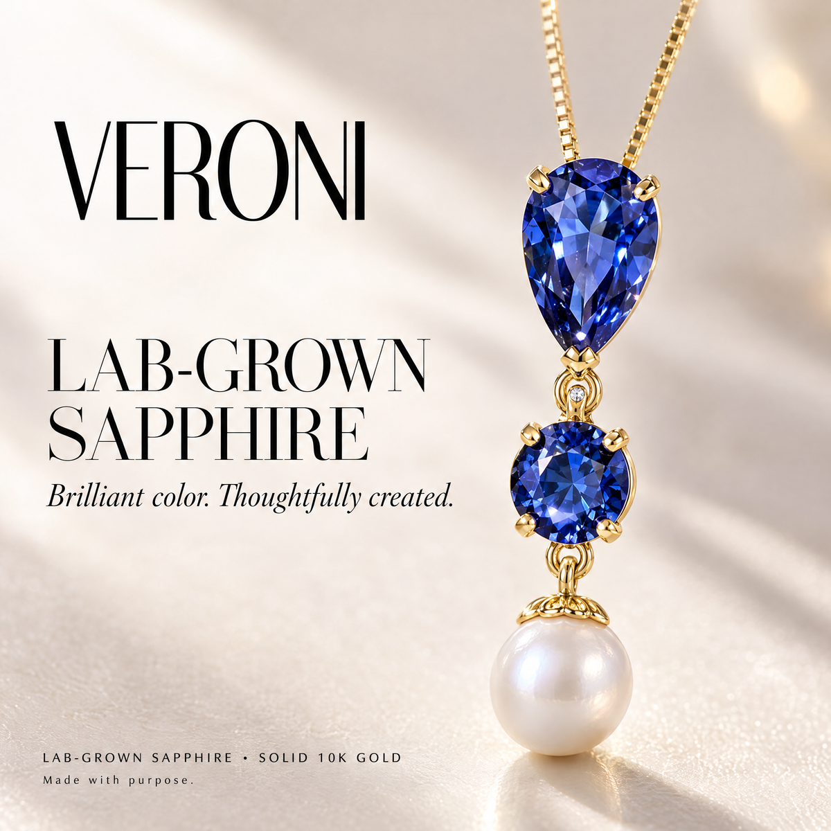 Yellow Gold Domitilla lab-grown sapphire pendant on a warm ivory background in a VERONI campaign.