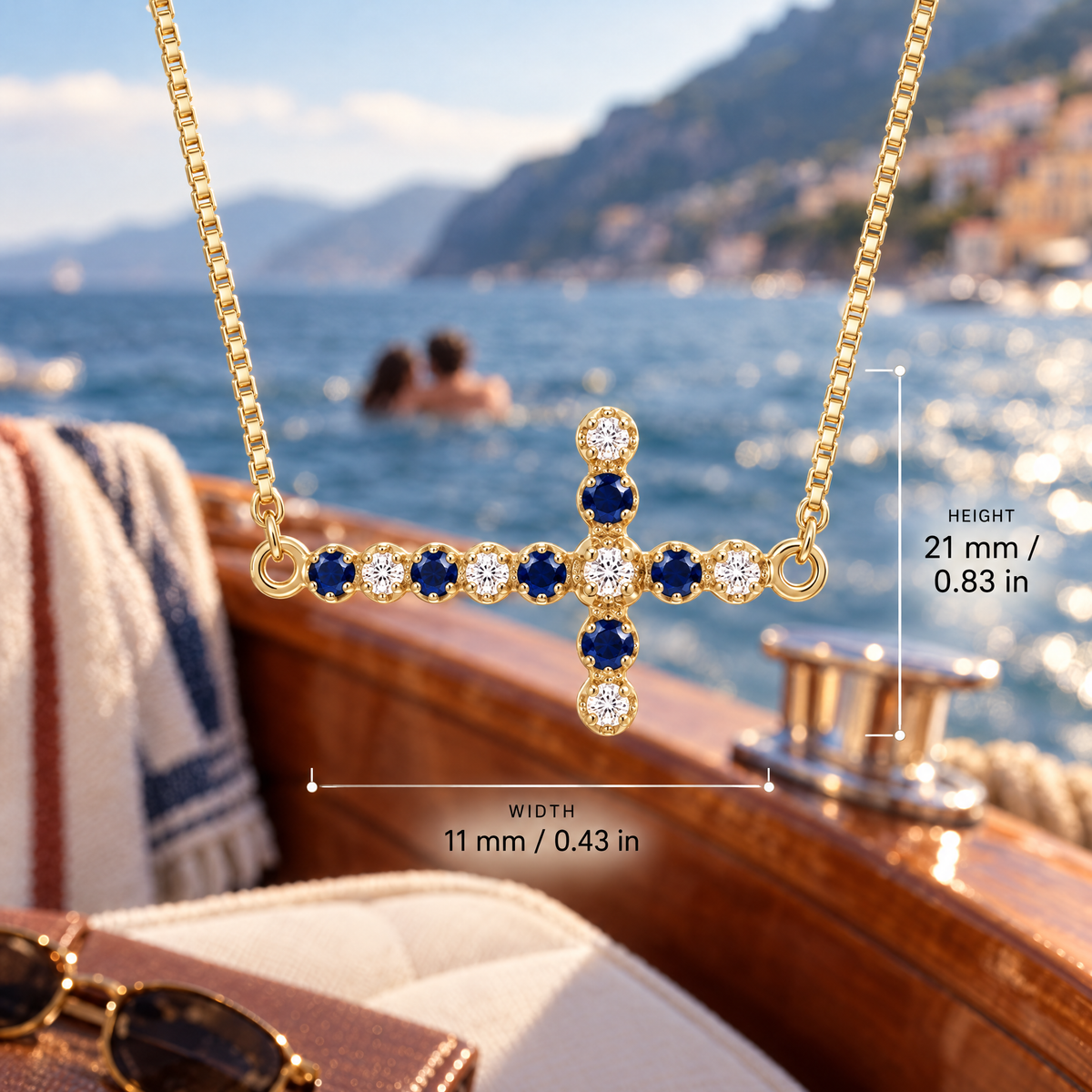 Yellow Gold Liberata sapphire and diamond pendant with dimensions: 21 mm high and 11 mm wide, against a boat setting.