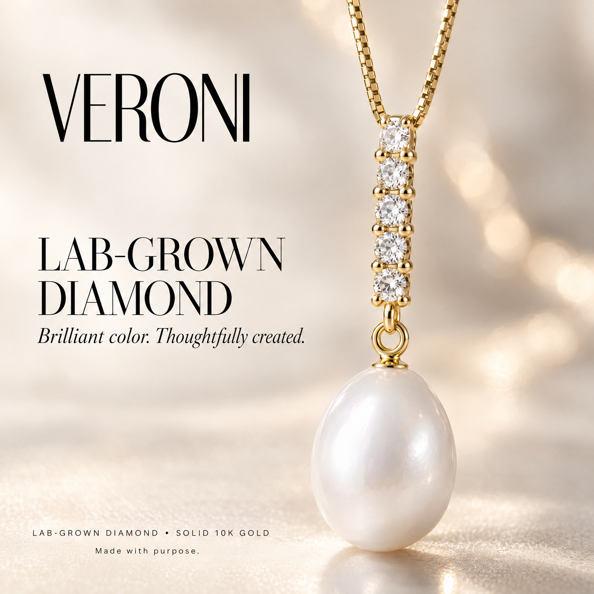 Yellow Gold Eulalia lab-grown diamond and pearl pendant on a warm ivory background in a VERONI campaign.