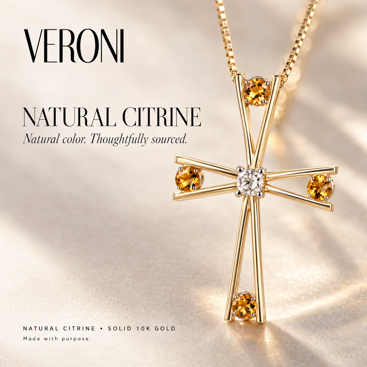 Yellow Gold Silvana natural citrine pendant on a warm ivory background in a VERONI campaign.