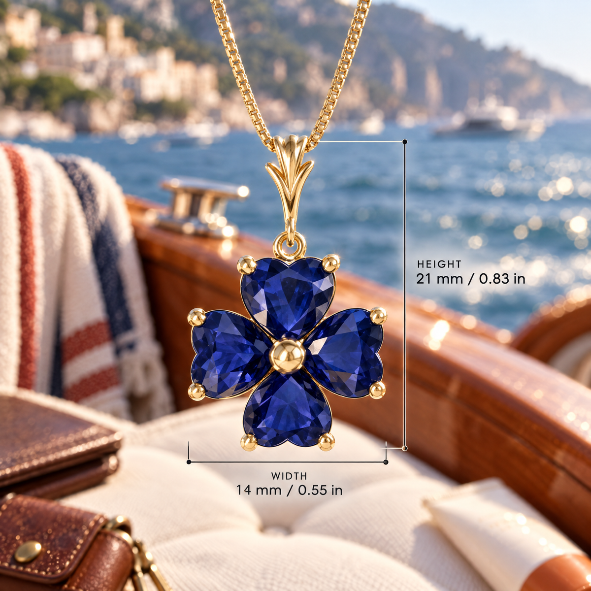 Yellow Gold Selene sapphire pendant with dimensions: 21 mm high and 14 mm wide, against a boat setting.
