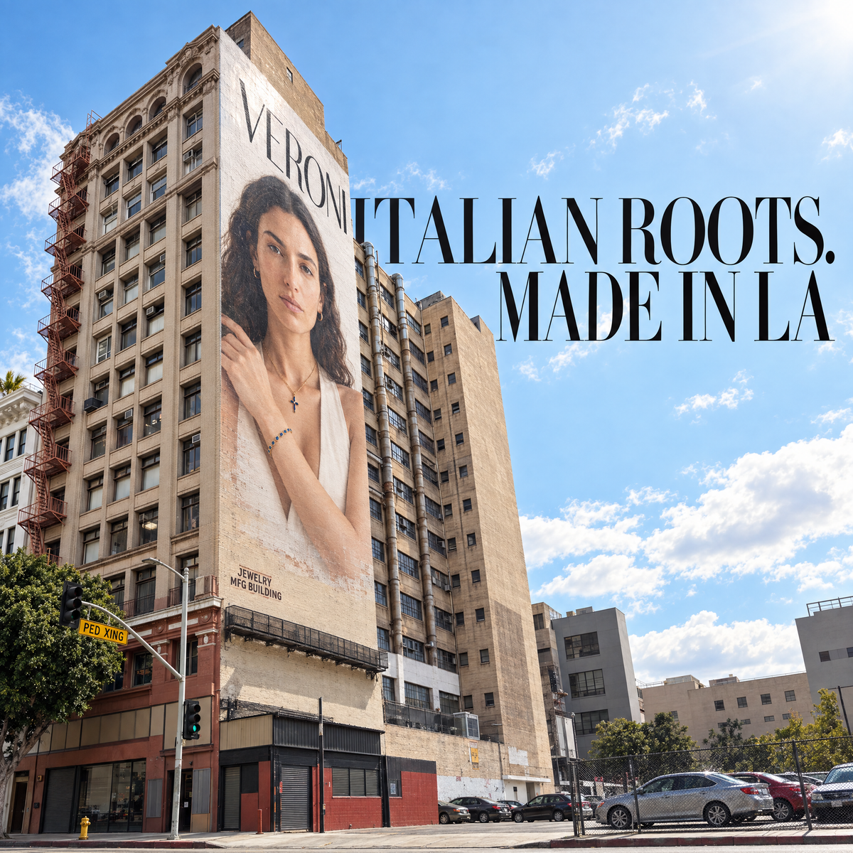 VERONI mural on the Los Angeles Jewelry Manufacturing Building beneath a blue sky. Italian roots. Made in LA.